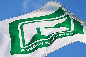 En flagga med Försäkringskassans logga på.
